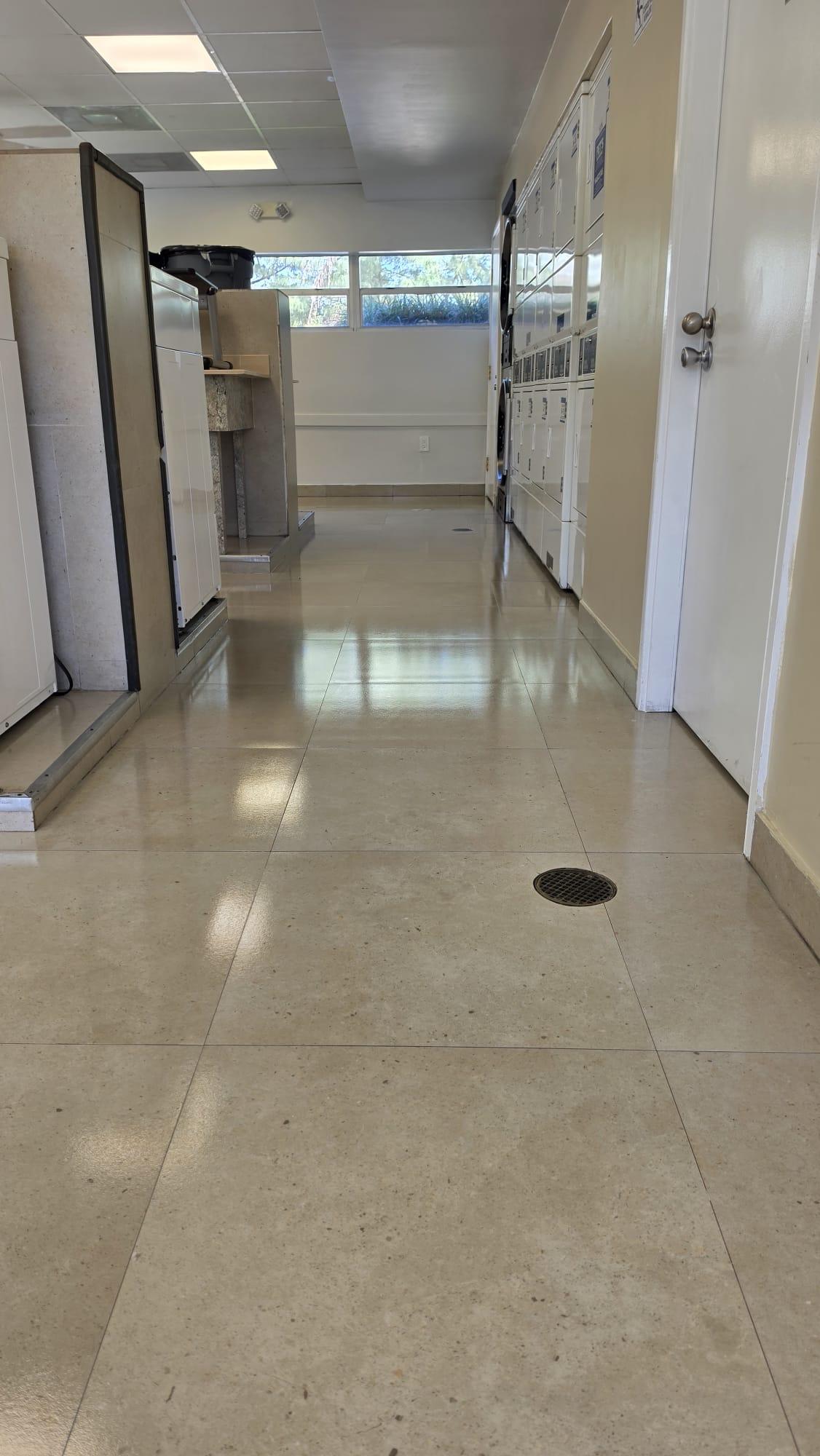 Porcelain Hallway After Ceramic Coating, Apartment Laundry Room Porcelain hallway floor after chemistry, controlled extraction and ceramic coating, ceiling lights reflecting in the floor, Miami-Dade