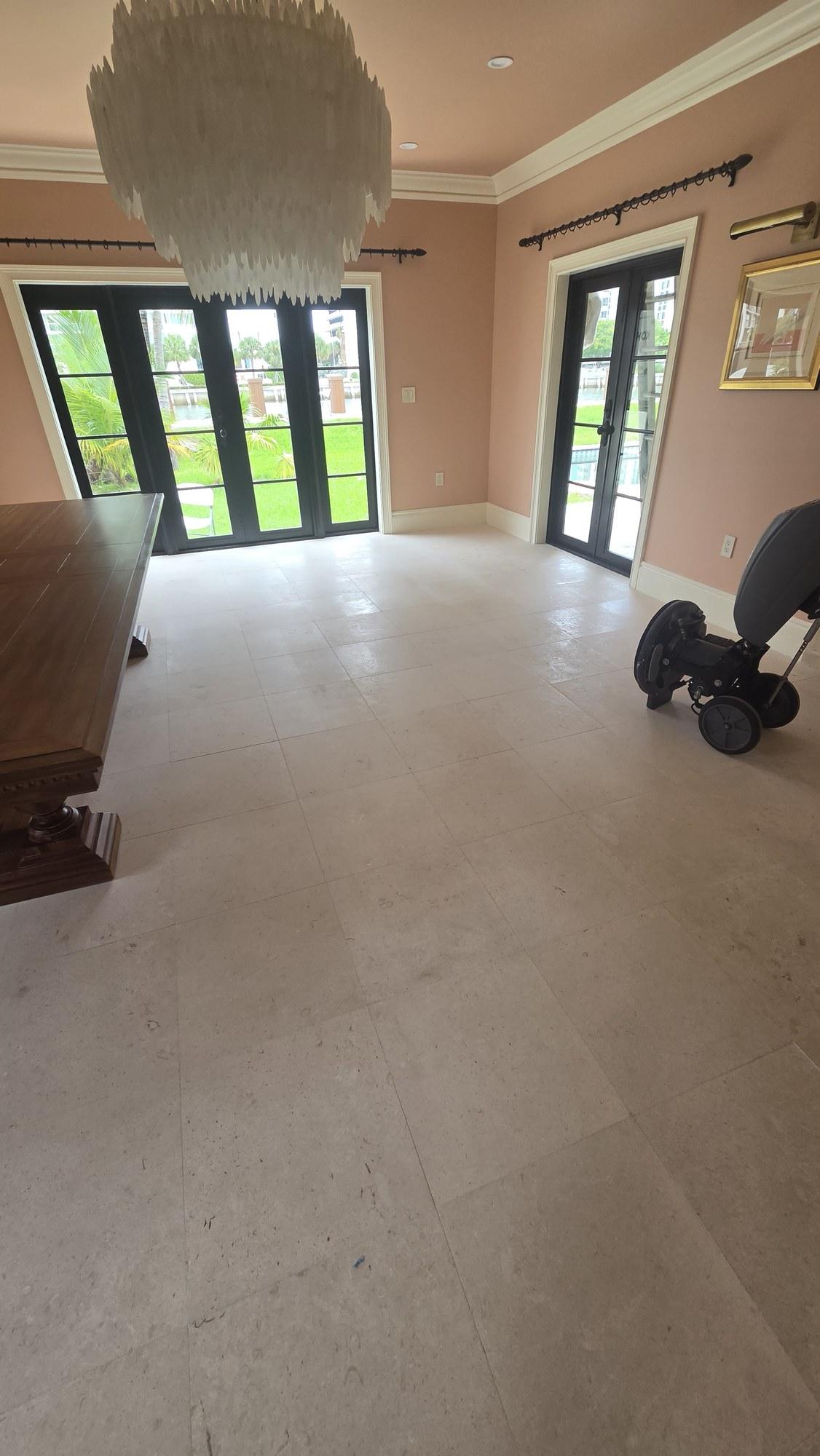 Shellstone floor in a Miami Beach home covered in construction haze after two years of renovation