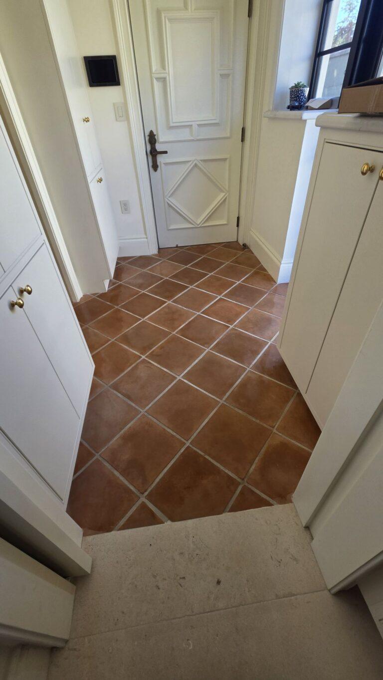 Sealer freshly applied to a real terracotta hallway floor in a Miami Beach home