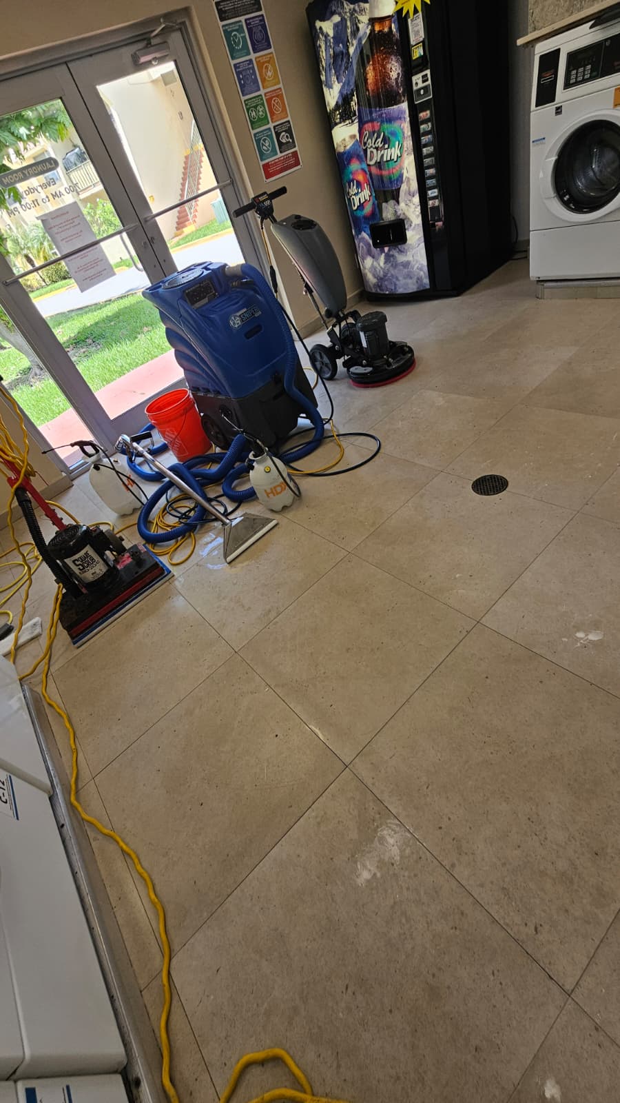 Tile and grout deep cleaning before a ceramic floor coating in a Miami-Dade laundry room