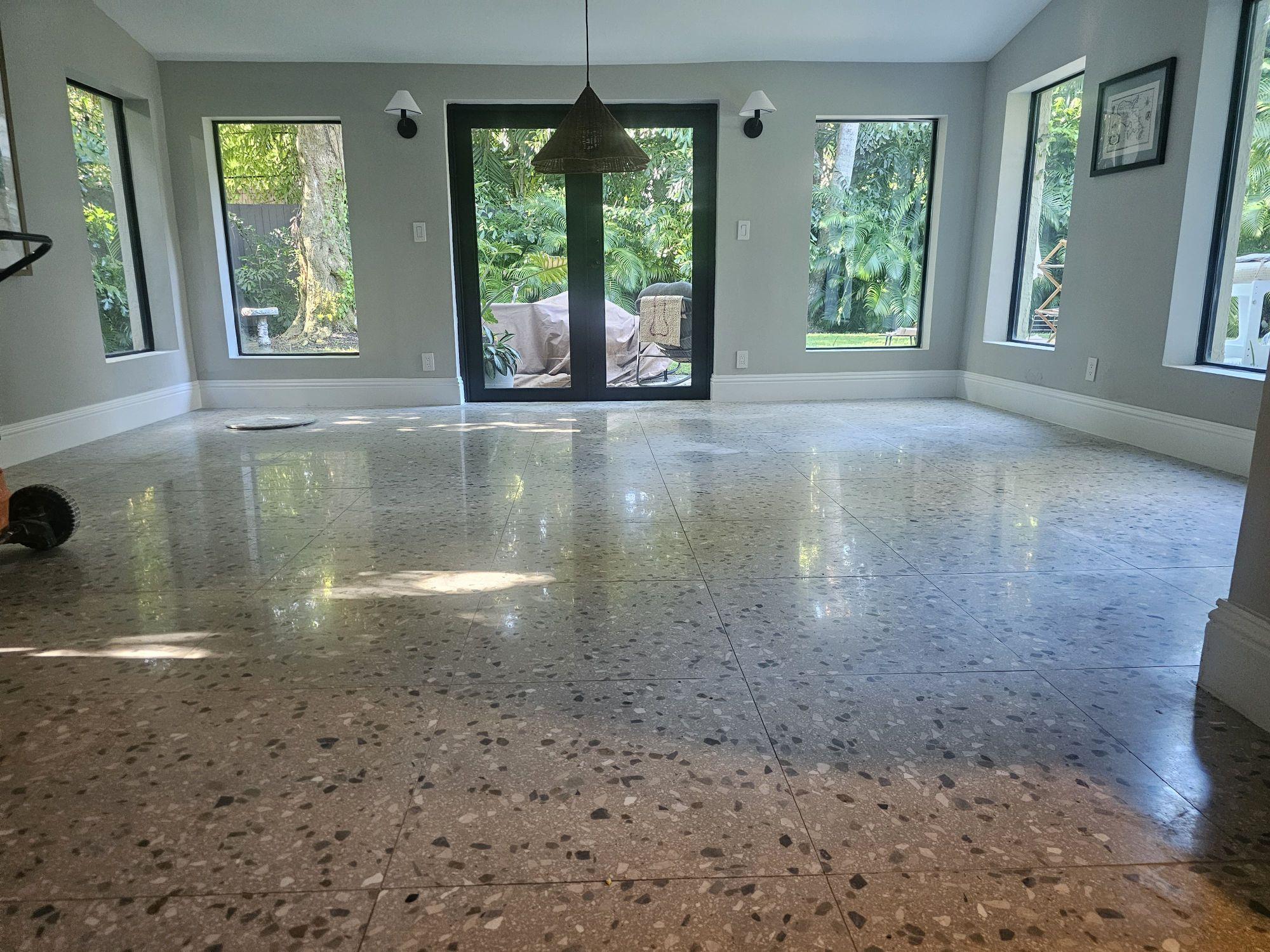 Coconut Grove living room terrazzo toward the glass doors, before cleaning and polishing