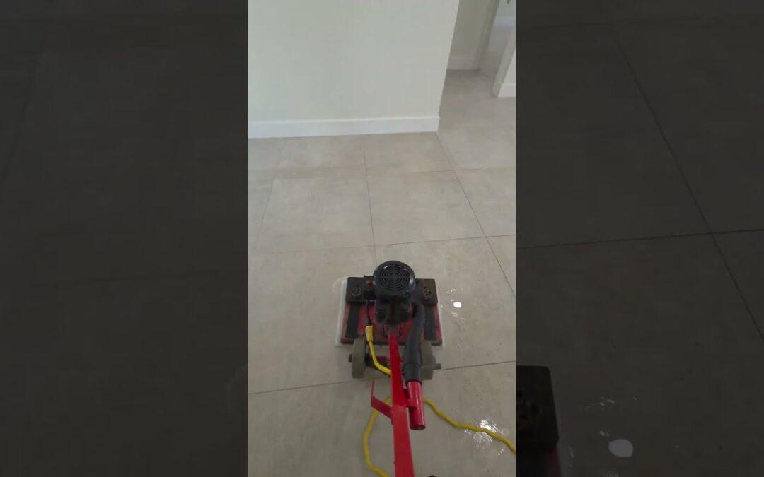Cleaning machine on large-format porcelain tile in an empty Miami Lakes home
