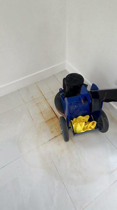 Machine working on rust stains on a Cutler Bay tile floor