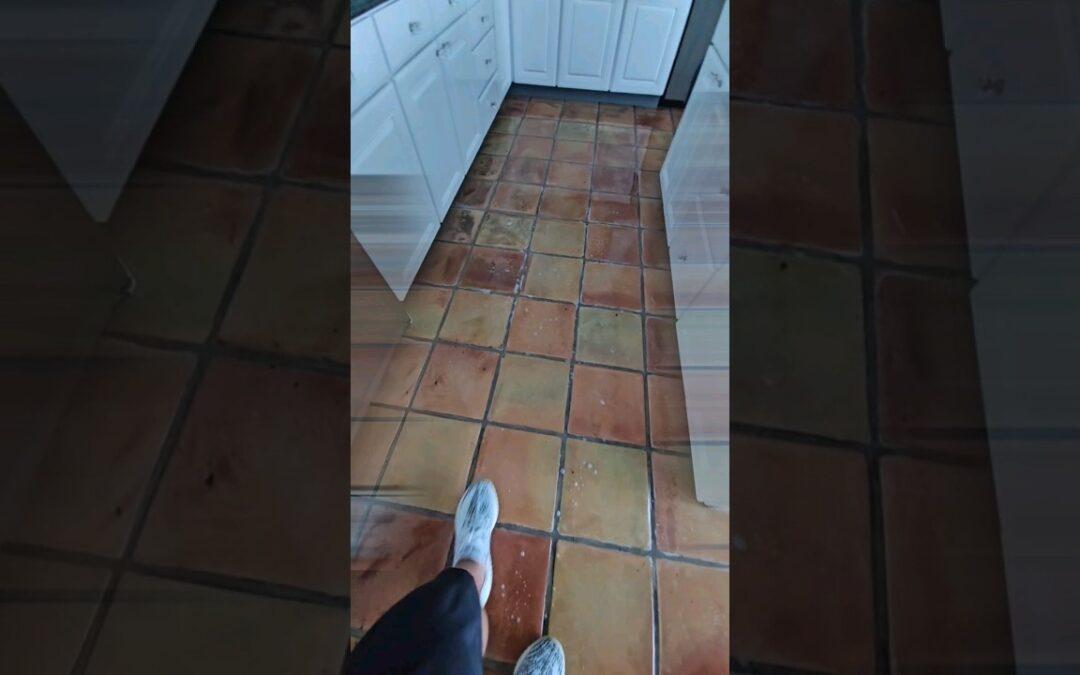 Aged Saltillo tile kitchen floor in a Pinecrest home