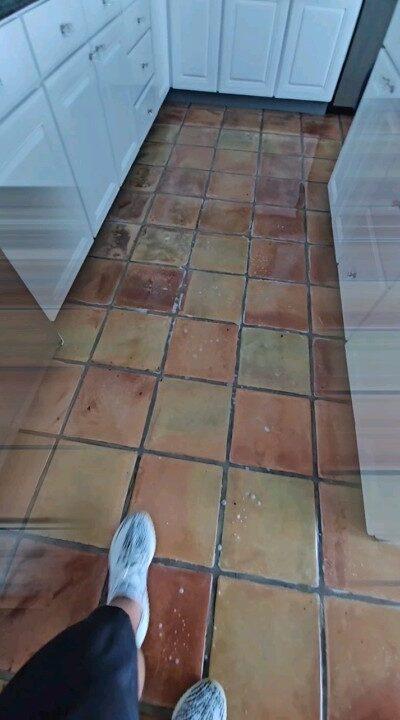 Aged Saltillo tile kitchen floor in a Pinecrest home