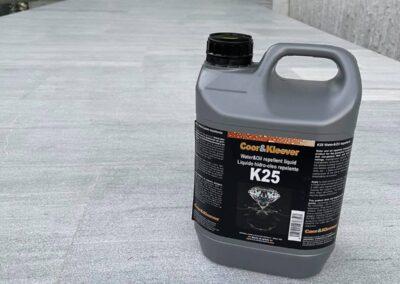 Container of penetrating water and oil repellent stone sealer on a cleaned natural stone patio in Miami before application