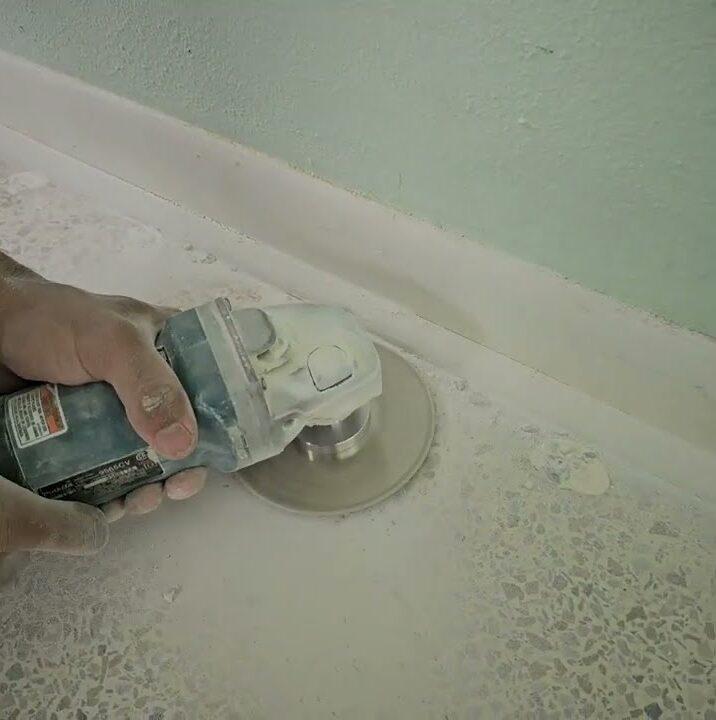 Grinding the edge of a terrazzo floor along the baseboard in Cutler Bay